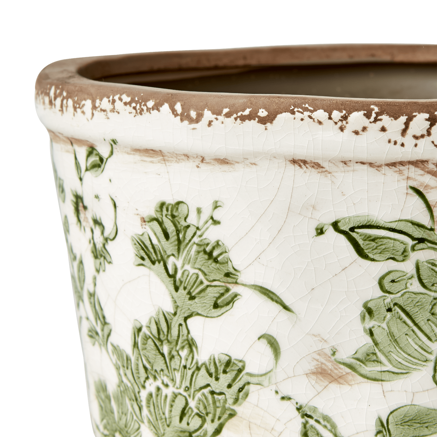 En lav blomsterpotte i keramikk fra Affari med et vakkert grønt mønster og vintage preg, alle er unike. Fyll den med dine favoritt planter og blomster. Dekorer både hjemmet og hytta.